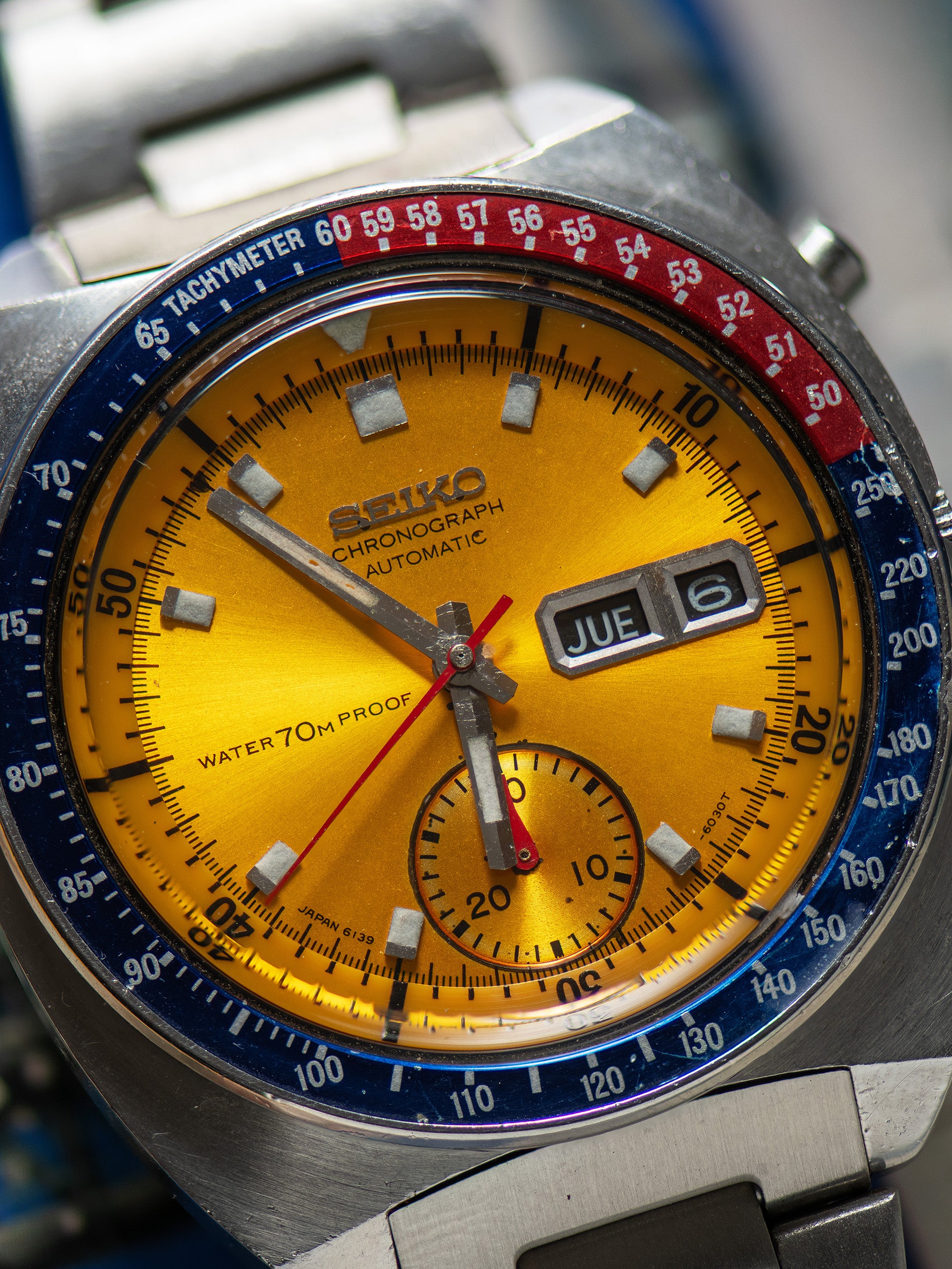 Seiko 6139-6000, Gold Dial, Notch Case. Documented specimen has an aftermarket bracelet. Photo: Craft + Tailored. · Photo: Craft + Tailored · © Craft + Tailored, used with permission · Source: https://www.craftandtailored.com/collections/seiko/products/1969-seiko-automatic-chronograph-pogue-ref-6139-6000-notch-case